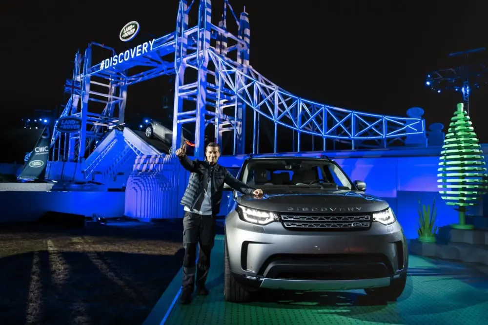 Stories Bear Grylls with the new Land Rover Discovery at its global unveiling at Packington Hall Solihull 1 - Stories